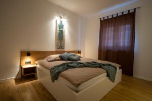 Cama ou camas em um quarto em Lea Apartments