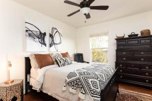 a bedroom with a bed and a ceiling fan at Relax in Style Near the Heart of Music City in Nashville