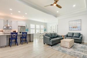 a living room with two couches and a kitchen at Bright Foley Home with Patio - 7 Mi to Wharf and Beach in Foley