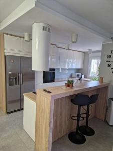 Kuchyňa alebo kuchynka v ubytovaní Magnifique Duplex vue mer