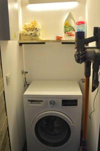 a washing machine in a small room with a camera at Can Senio 3 in Tossa de Mar