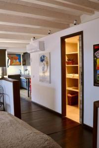 a room with a door leading to a kitchen at Can Senio 3 in Tossa de Mar