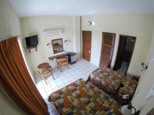 a living room with a couch and a table at Hotel Davimar in Guamúchil