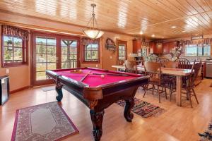 a living room with a pool table in it at Bear family Ranch - Perfect for groups! ideal location for stargazing and sky watching! in Big Bear City
