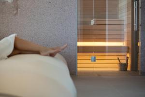 Un ou plusieurs lits dans un hébergement de l'établissement Unico Hotel Caorle
