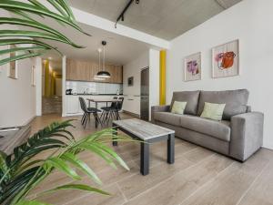 a living room with a couch and a table at Alojamientos Miss Tic Ciudad Vieja Coruña in A Coruña
