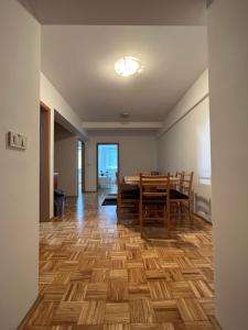 a dining room with a table and chairs at Apartma Lunca 2 in Ljubljana