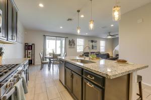 a kitchen with a sink and a counter top at Spacious Avondale Home with Patio and Pool Access! in Avondale
