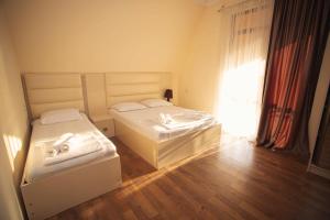 Postel nebo postele na pokoji v ubytování Hotel Irise