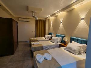 Katil atau katil-katil dalam bilik di Gem Overlooking inn