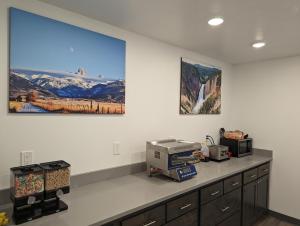 a kitchen with a counter with a printer on it at Henry's Fork Inn in Saint Anthony