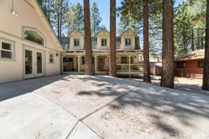 a large house with trees in front of it at Summit Mountain Lodge - Amazing location just down the street from Snow Summit! in Big Bear Lake