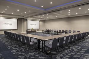 a large conference room with a long table and chairs at Courtyard by Marriott Long Beach Downtown in Long Beach
