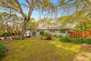 a house with a tree in a yard at Livin' the Dream in Pebble Beach