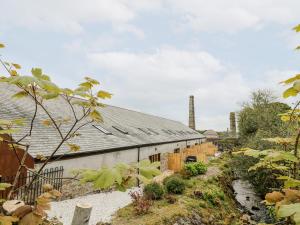 a building with solar panels on the side of it at The LinneyThe West Dry in St Austell