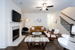 a living room with a couch and a fireplace at 2022 quiet relaxing and secure town house near Atlanta in Redan