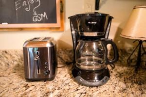 a blender and a toaster sitting on a counter at Wears Valley Cabin on 5 Acres, Hot Tub, Pets in Sevierville