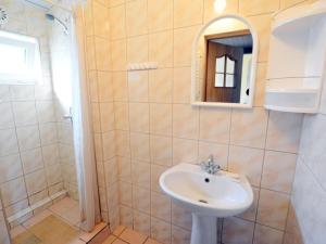 a bathroom with a sink and a shower at Cottage in a quiet area, near the lake, Rosnowo in Rosnowo