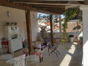 a kitchen with a table and chairs in a room at Banica Apartments & Rooms in Split