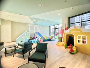 a childrens play area with chairs and a play room at Westgate Apartment- 2N House in Ho Chi Minh City