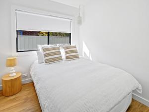 Gorgeous Getaway Toowoon Bay客房内的一张或多张床位