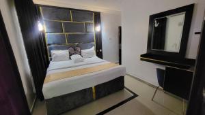 Postel nebo postele na pokoji v ubytování Palazzo Apartments