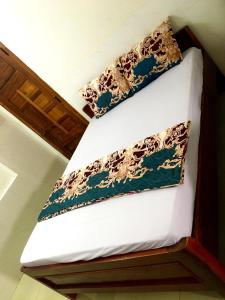 a bunk bed with two pillows on top of it at khách sạn Ngân Hà in Tuy Hoa