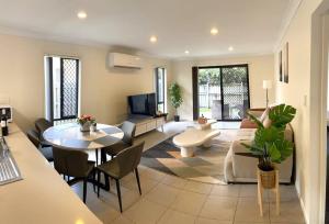 a living room with a couch and a table at The peaceful place to stay – in Gold Coast