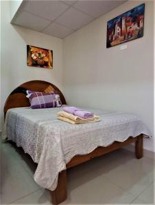 Carlos Guest House 2 Cusco客房内的一张或多张床位