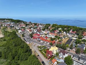 an aerial view of a small town near the ocean at Polanka Apartamenty in Niechorze