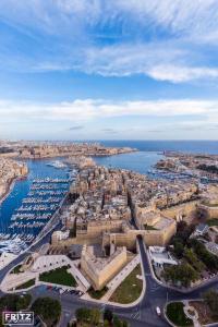 an aerial view of a city with a body of water at Dar Barbara - Duplex 1 Double Bed Maltese style House in Cospicua