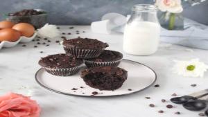 a plate of chocolate muffins on a table with milk at Heaven Is A Place On Earth in Montreal +14 photos