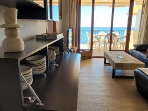Posezení v ubytování Playa Canadell MAR G primera linea de mar con terraza
