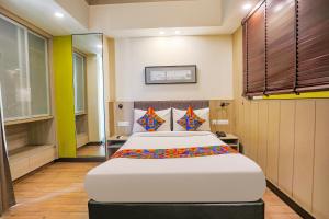 Krevet ili kreveti u jedinici u okviru objekta FabHotel Sapphire 83