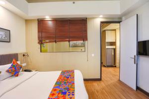 TV i/ili multimedijalni sistem u objektu FabHotel Sapphire 83