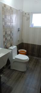 a bathroom with a toilet and a sink at Beach Dreamz Villa 2 BHK Near Pondy and Auroville in Marakkānam