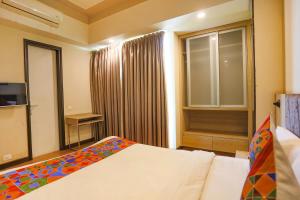Krevet ili kreveti u jedinici u okviru objekta FabHotel Sapphire 83