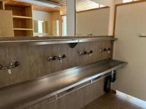 a bathroom with a sink and a mirror at Berggasthaus Zanuz in Bad Ragaz