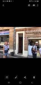 two pictures of people standing outside of a restaurant at appartement renové , quartier historique du panier , centre-ville in Marseille