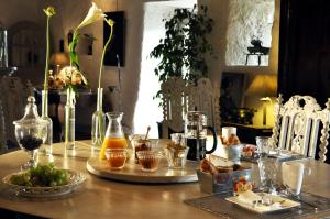 a table with a bunch of food and drinks on it at Le Relais de Roquefereau in Penne-dʼAgenais