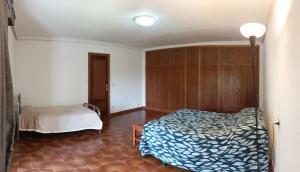 A bed or beds in a room at Casa de Familia Estela Baño Compartido
