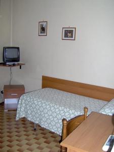 Postel nebo postele na pokoji v ubytování Lago Maggiore