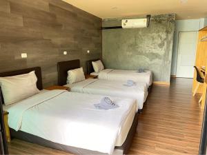 พบรักรีสอร์ท Pobruk resort客房内的一张或多张床位
