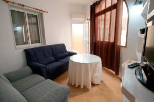 Televízia a/alebo spoločenská miestnosť v ubytovaní Chalet Completo Luna de Carboneras