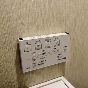 a white electrical box on a wall above a toilet at AYA Hotel in Tokyo