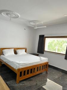 Voodi või voodid majutusasutuse ANAND Beach Guesthouse by Moonrocks toas