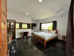 Voodi või voodid majutusasutuse ANAND Beach Guesthouse by Moonrocks toas