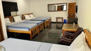 Voodi või voodid majutusasutuse ANAND Beach Guesthouse by Moonrocks toas