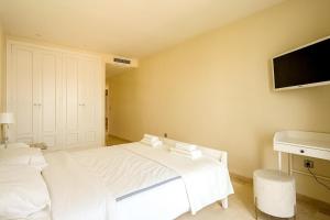 Łóżko lub łóżka w pokoju w obiekcie Luxury apartment Sotogrande