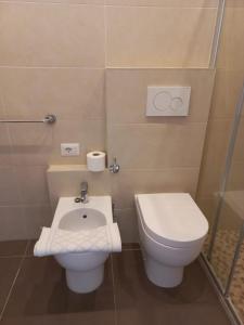 Koupelna v ubytování Hotel Helvetia